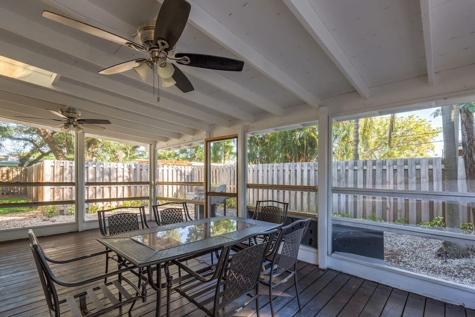 covered patio with outdoor dining and bbq