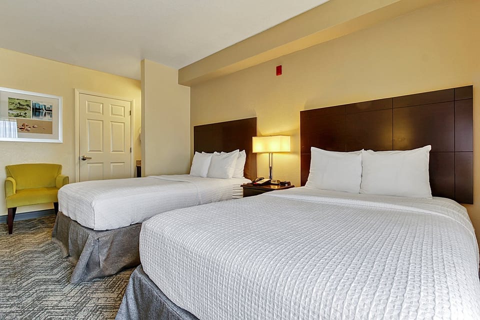 Sink into crisp linens and enjoy soft bedside lighting.