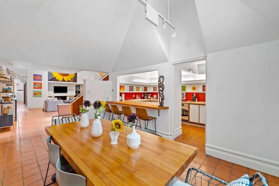 A better view of the dining with a sneak peak of the living room and kitchen