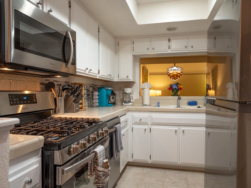 Kithcen has new stainless steel appliances.