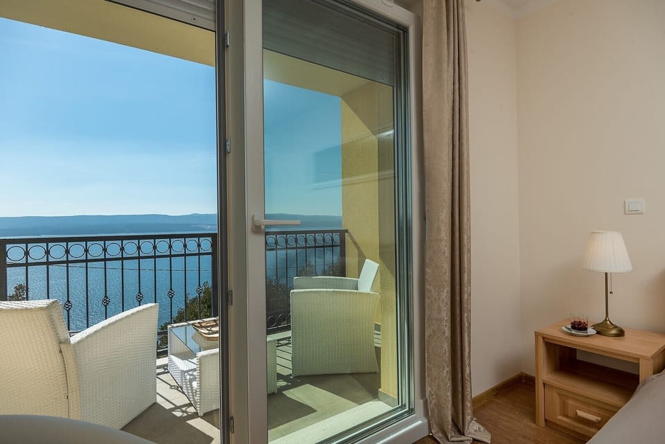 Bedroom No1 with a super king-size bed 200 x 210 cm, A/C, a terrace with sea views