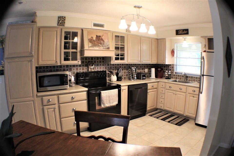 Downstairs kitchen & dining area with an open floor plan to living room