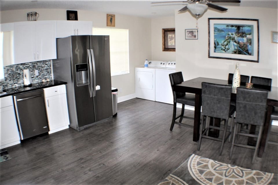 Upstairs laundry near kitchen and dining