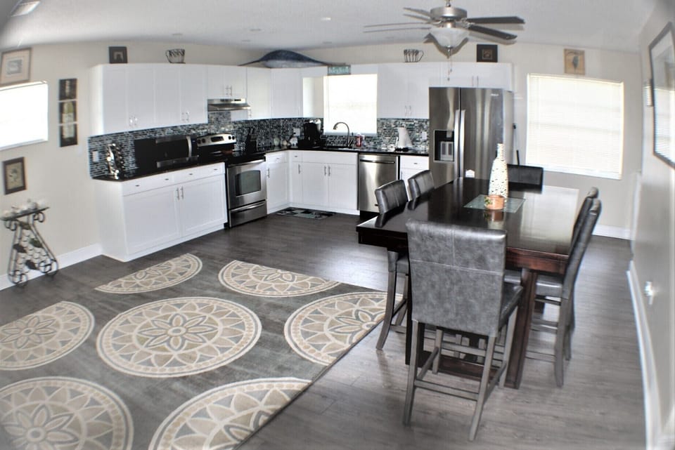 Upstairs kitchen & dining area with an open floor plan to living room