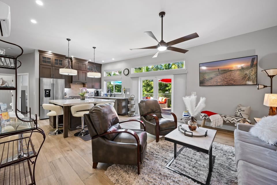 Living room with 55-inch TV and fan.  