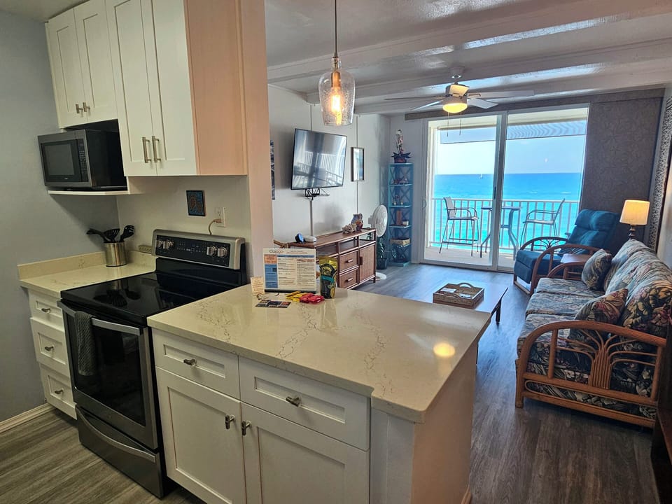The kitchen includes newly installed appliances and thoughtful touches that make meal prep easy for long or short stays.