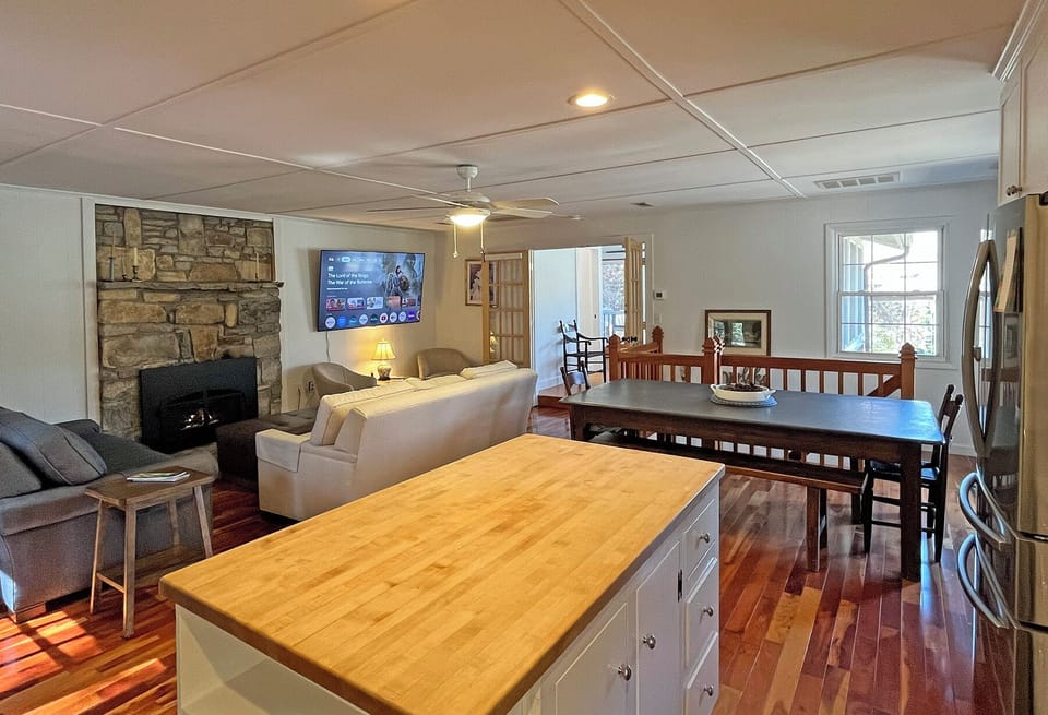 View of Kitchen, Dining and Family Room.  Family Room also has a Queen sleeper-sofa.  Family Room has gas fireplace, flat screen Smart TV and plenty of seating