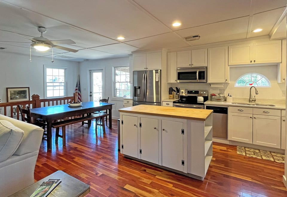 Family Room, Dining and Kitchen have direct access to Boathouse Deck and gas Weber BBQ grill