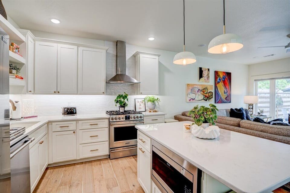 Fully stocked kitchen features high end All Clad cookware.