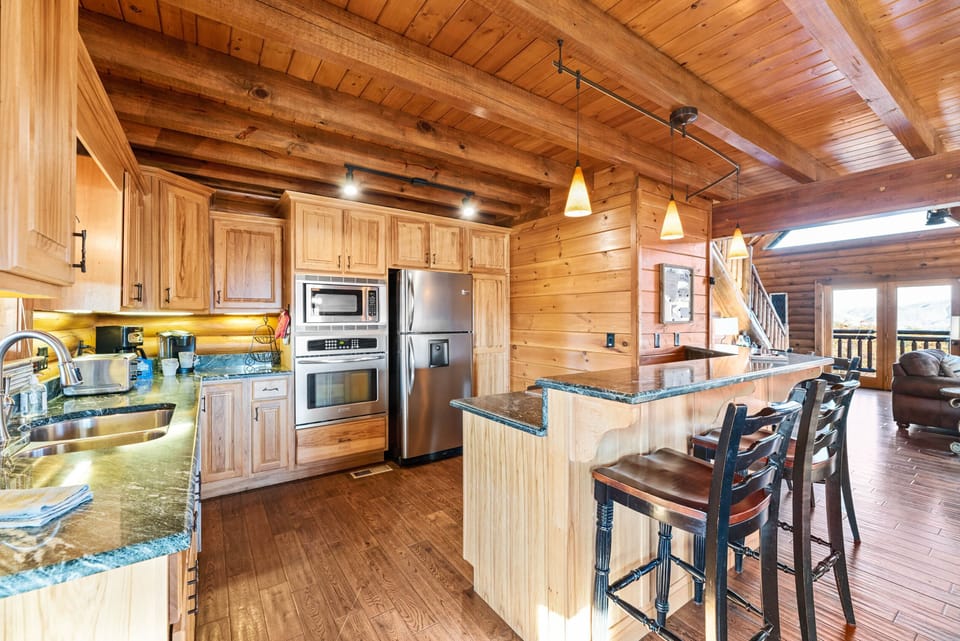 Fully stocked kitchen with breakfast bar.