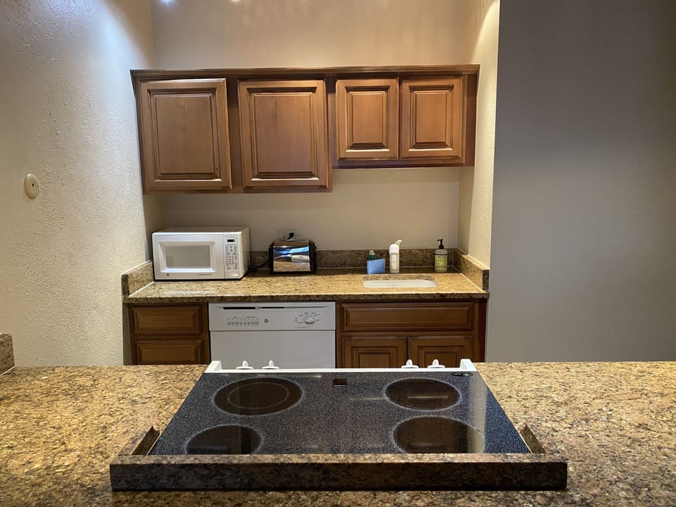 Full kitchen with all the supplies you'll need for cooking in the unit!