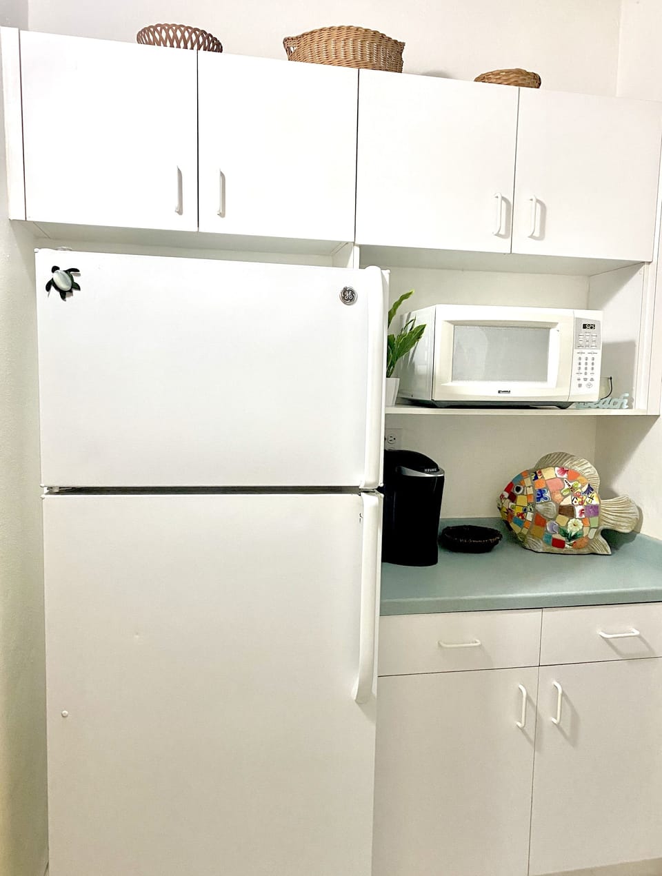 Microwave and Keurig coffee maker, as well as a regular coffee maker as well.