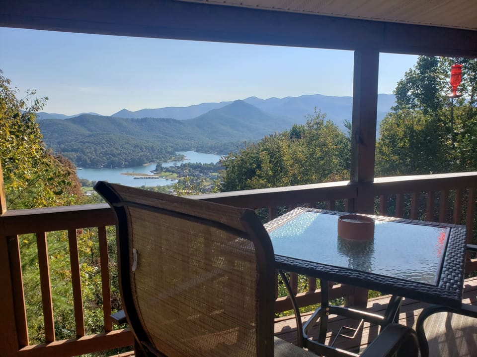 To high top table and chairs on the river porch with a view