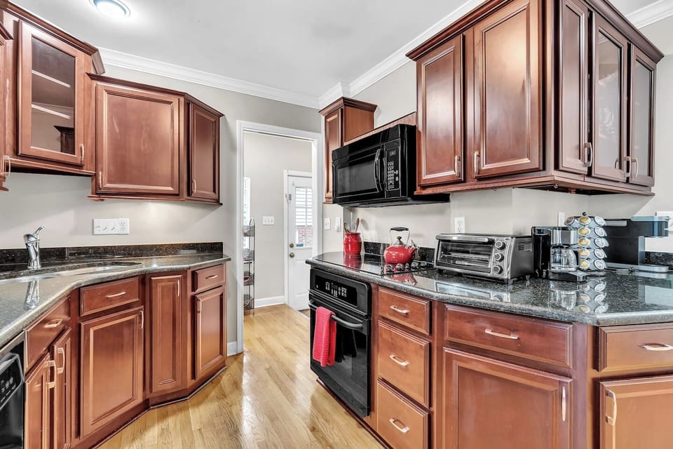 The spacious, fully equipped kitchen is ready for your cooking creativity. Make those tasty meals and serve them on the adjacent dining table.