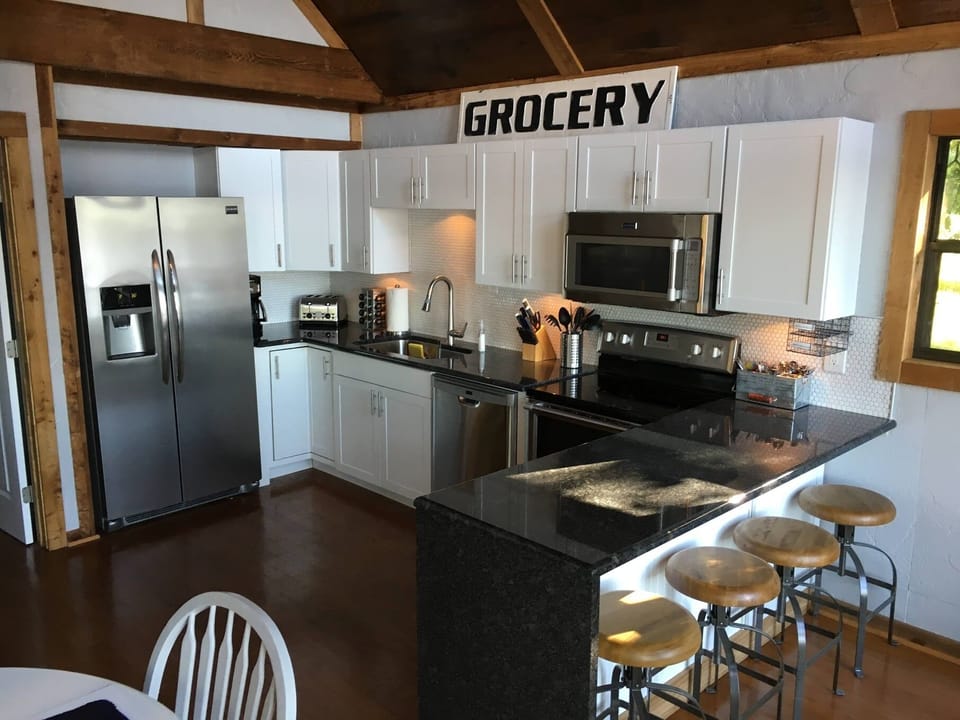 Updated kitchen with stainless appliances, granite and a breakfast bar. 