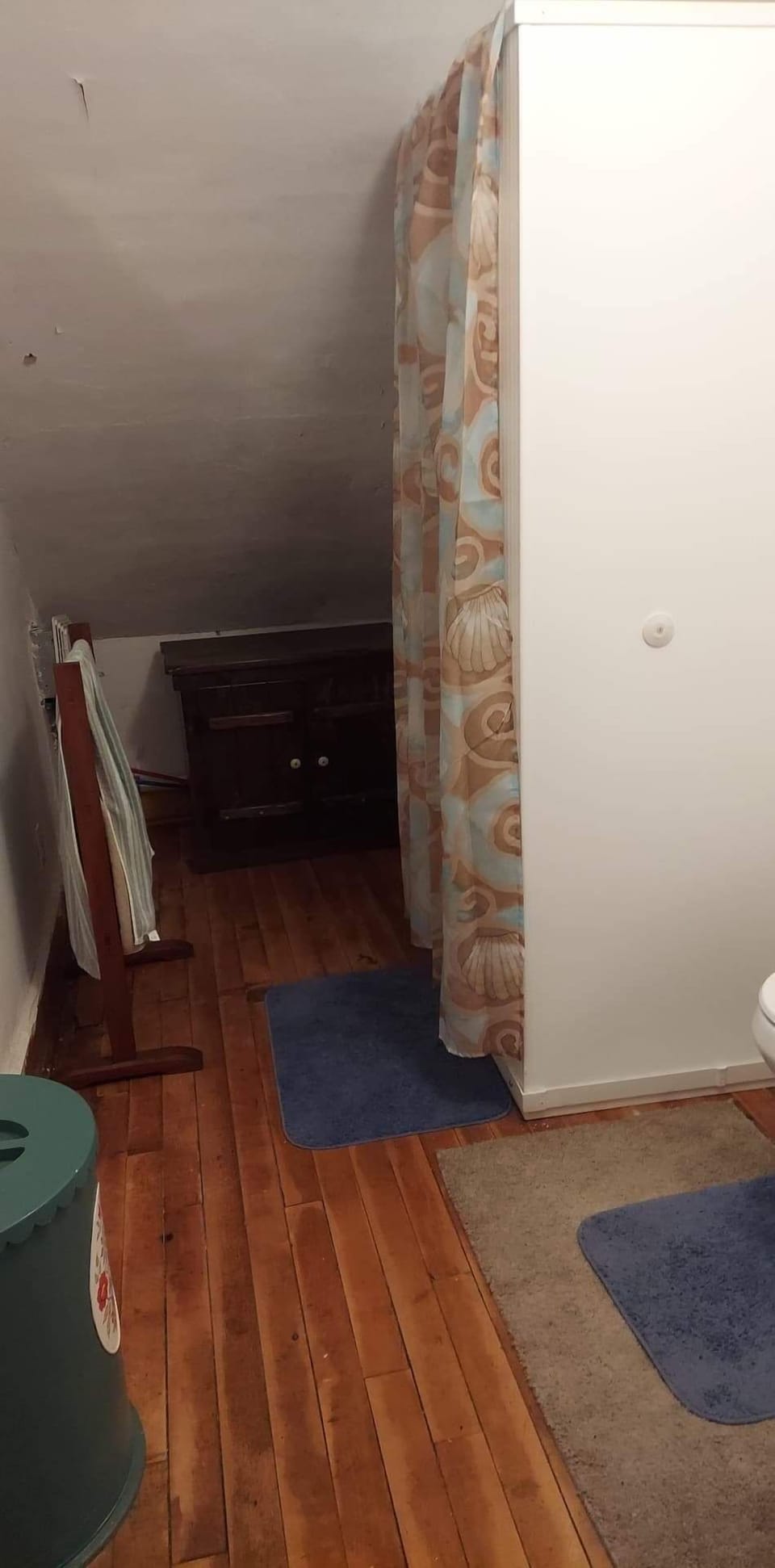 Shower, sink hiding behind shower.