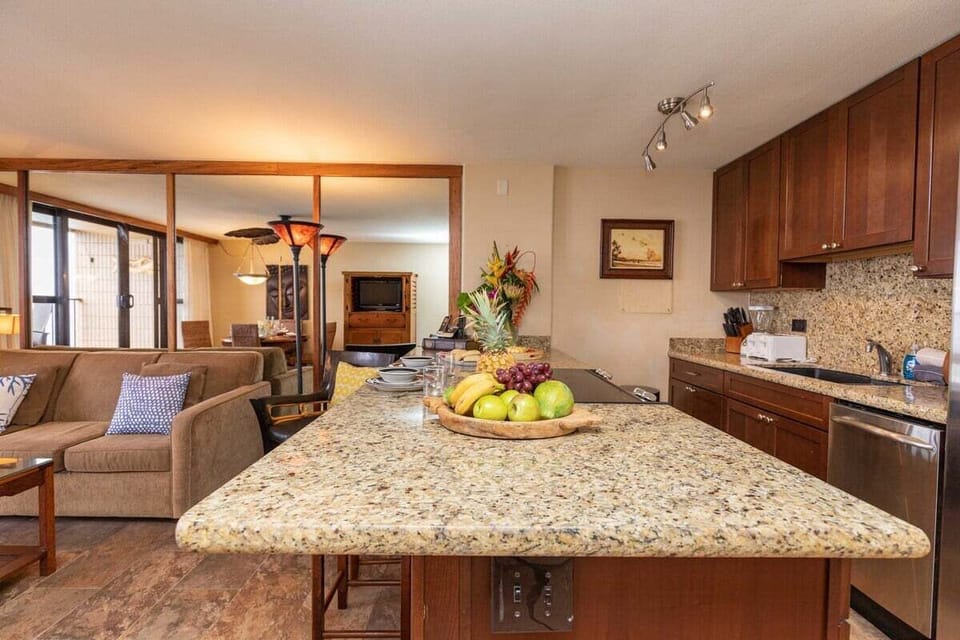 Spacious kitchen with granite countertop, perfect for meal prep and casual dining