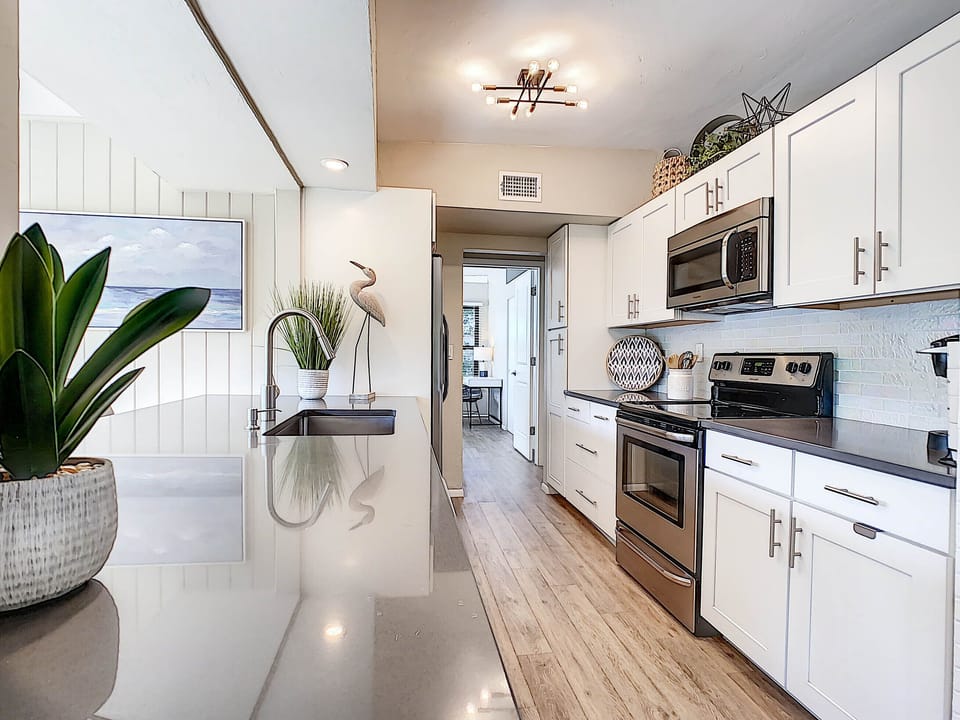 Open island overlooking yard and lots of cabinet space.