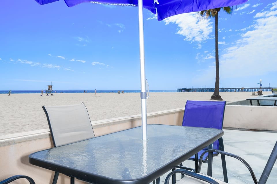 Private oceanfront patio with front-row beach views
                