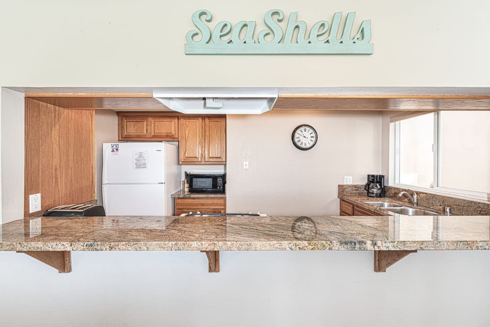 Kitchen bar area opens to the living areas, making family dinners fun and easy.
                