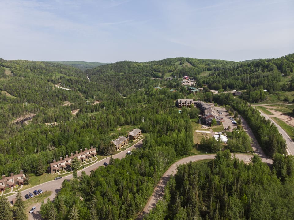 View from bottom of townhomes up to chalet.
