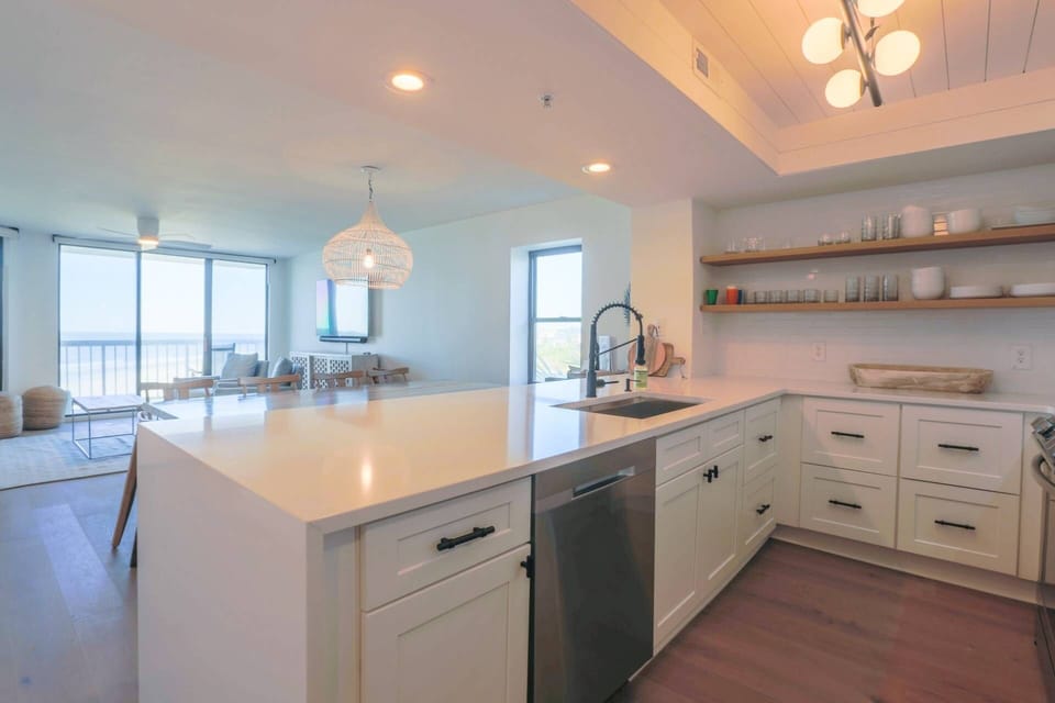 The kitchen also features stainless steel appliances.