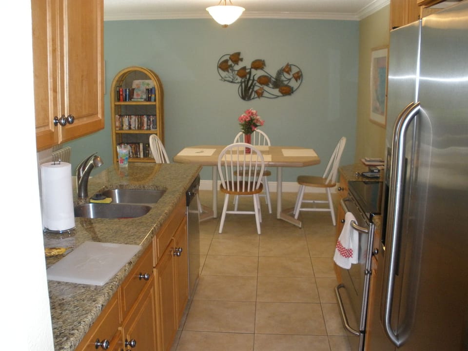 View from hallway through kitchen to dining area