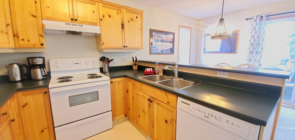 The kitchen has full-size appliances