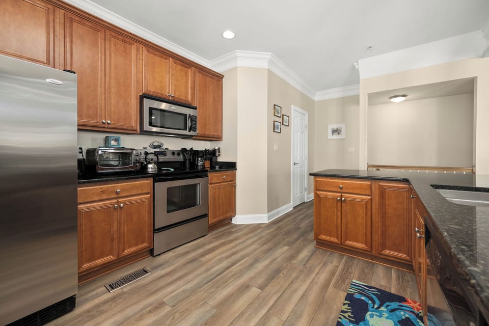 Spacious kitchen with stainless appliances and ample counter space