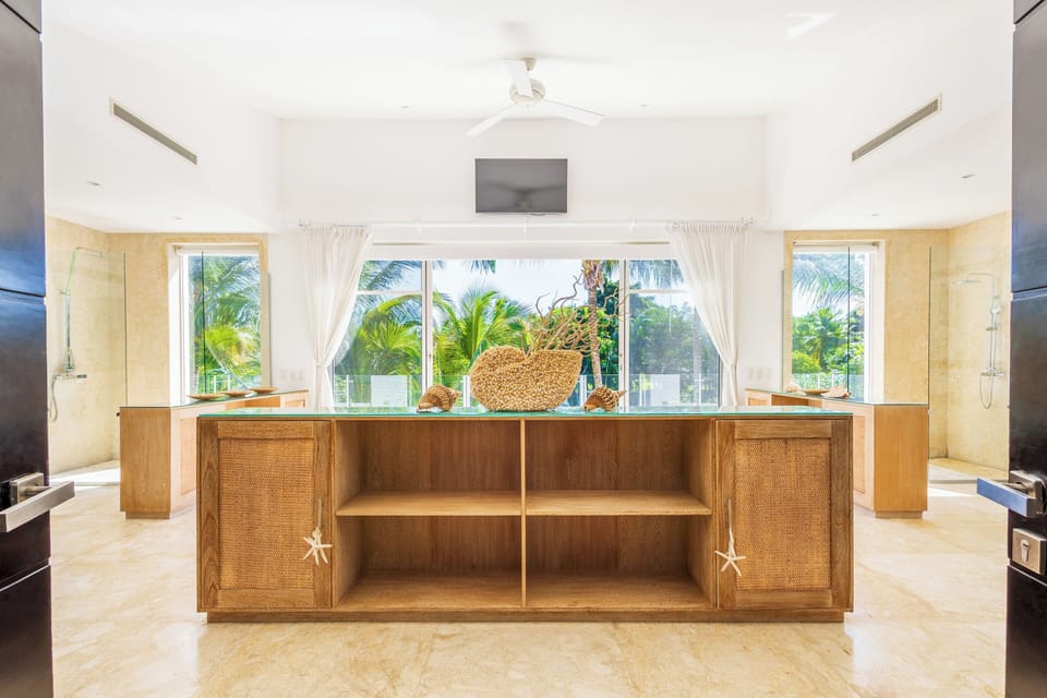 Wake up to golf course views through large windows.