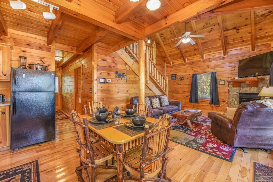 Stairs  take you to the loft or head to the rest of the cabin down the hall