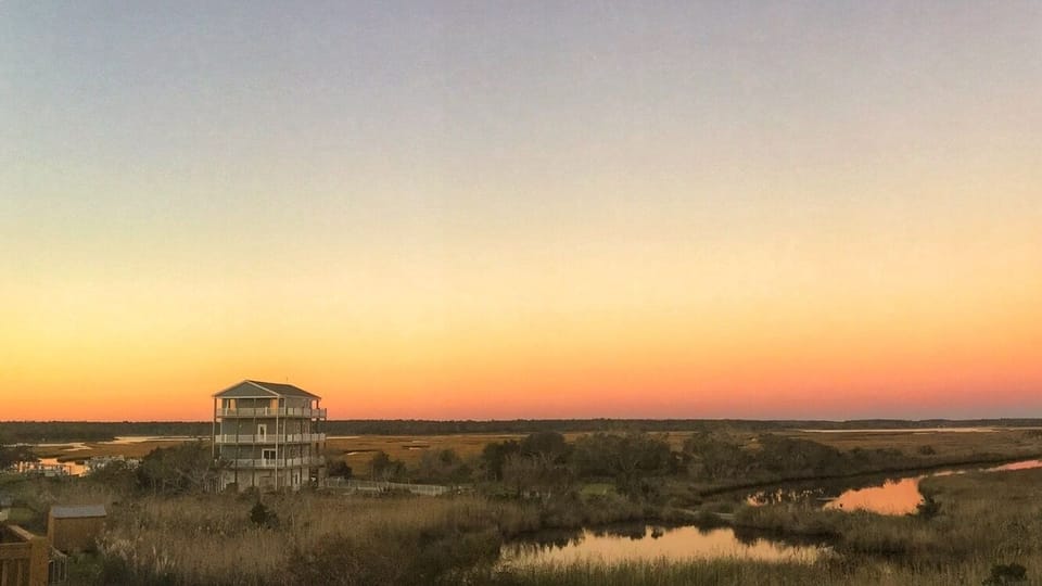 Sunset view from top floor backyard deck.
