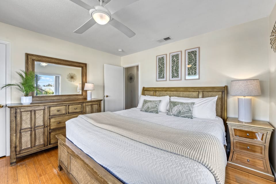 The spacious design and relaxed coastal charm that make the bedroom a serene retreat.