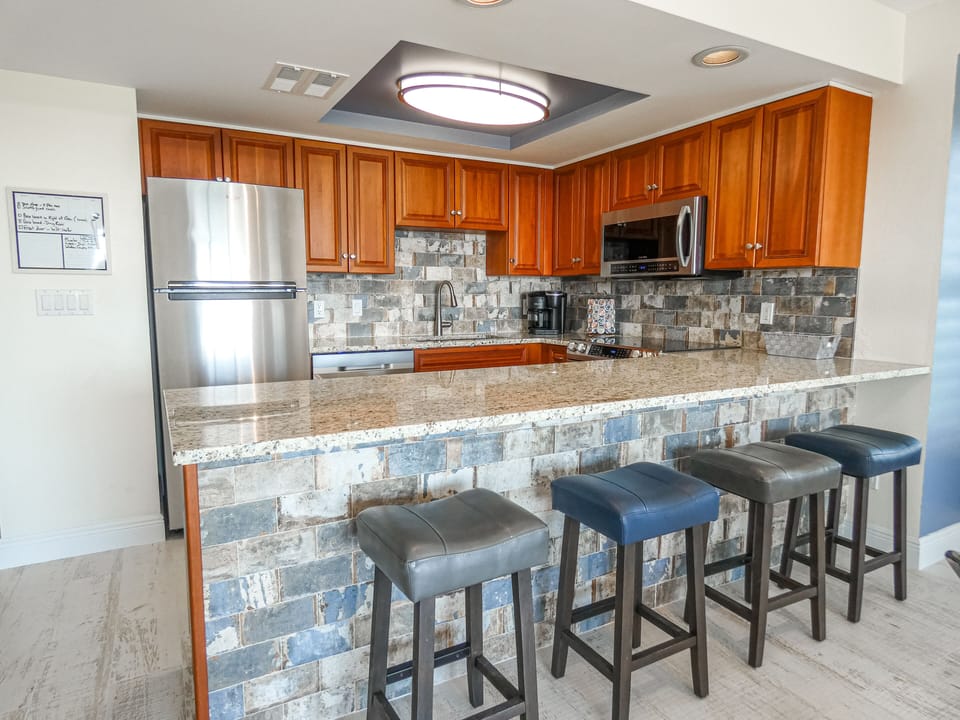 Renovated kitchen with breakfast bar, ss appliances 