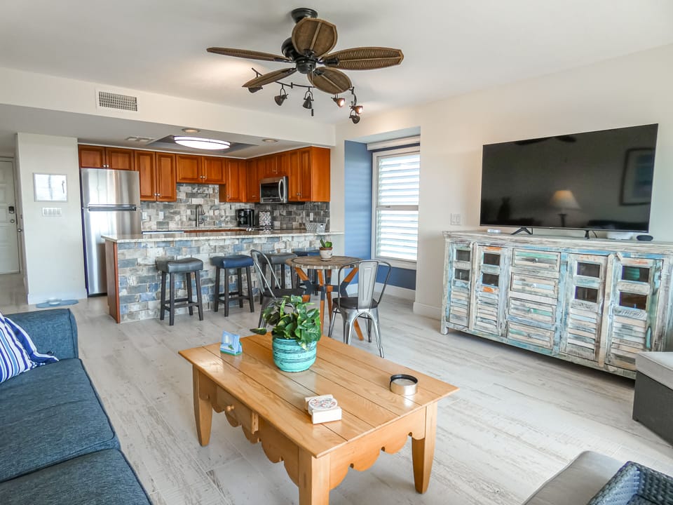 Open living room - whole  unit has tile floors to give a beach vibe! 