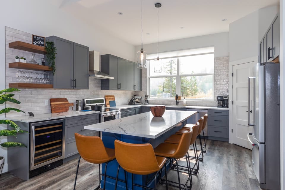 fully stocked kitchen with island seating for 6