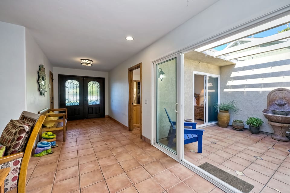 Front door and hallway opens up to atrium.