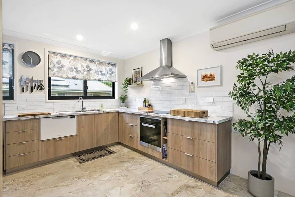 Spacious Kitchen with quality Asko induction cook top & oven, dish draw.