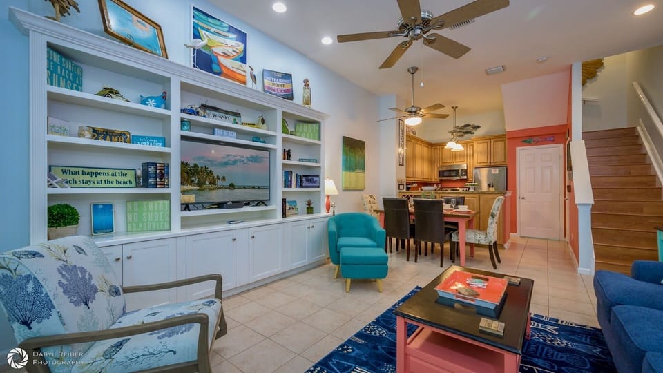 The first floor of the townhome features the living room, dining area, and kitchen...