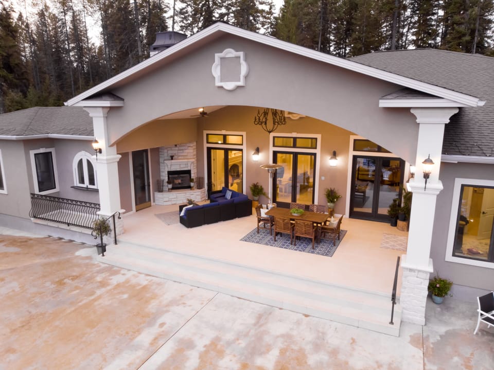 Door left of the fire place is an outdoor kitchen, perfect for serving drinks.