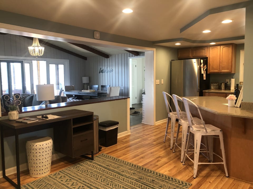 Kitchen with desk space, open to living room and dining room
