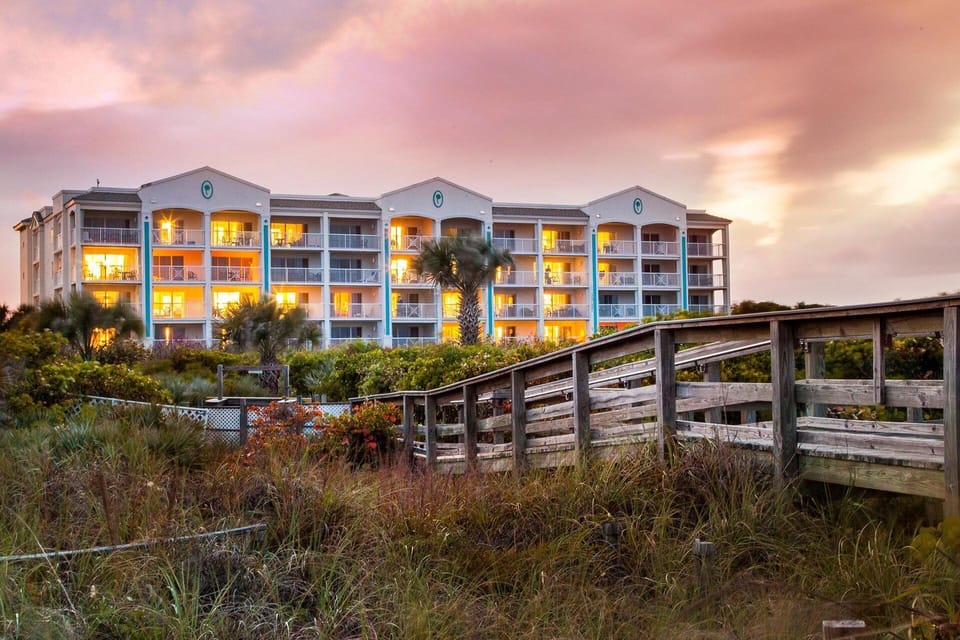Boardwalk to the beach and oceanside building.