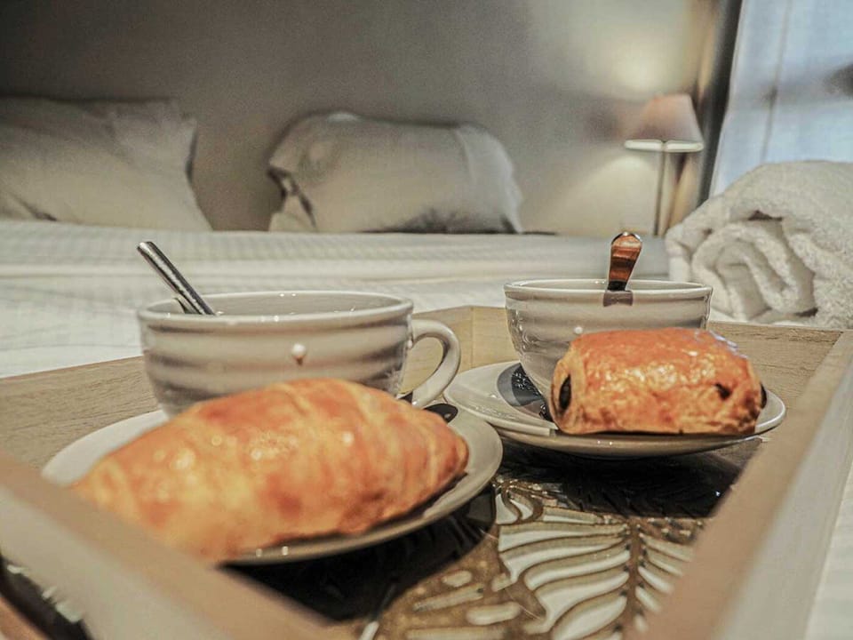 Croissants on the bed in Le Cairn
