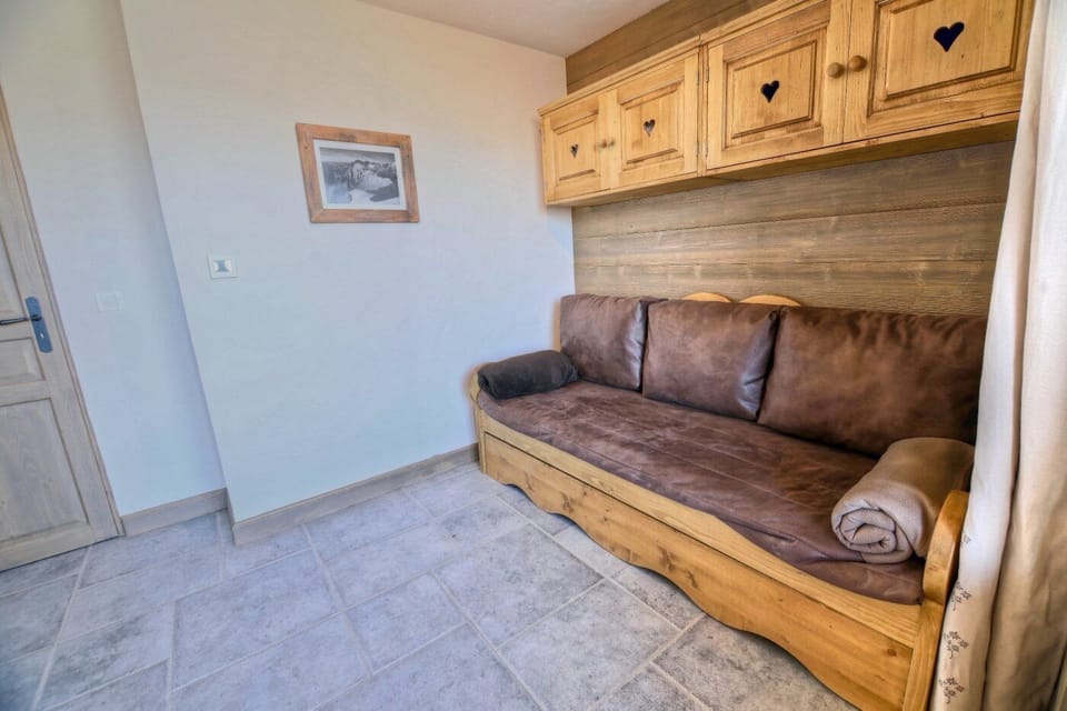 Room with sofa bed and outside access