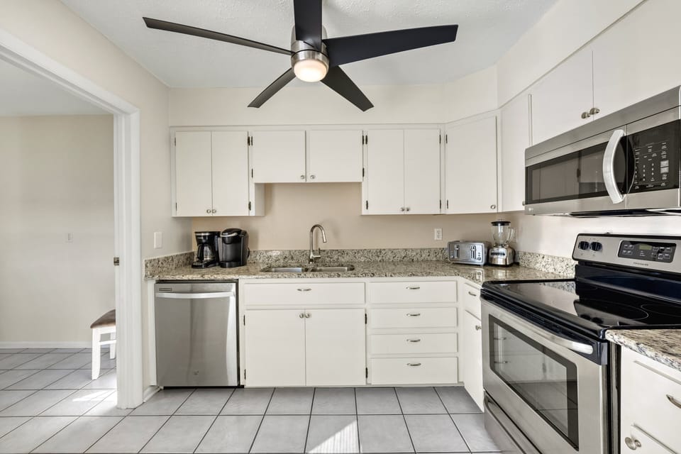 Effortless style and function meet here—sleek counters and upscale appliances inspire culinary creativity.
