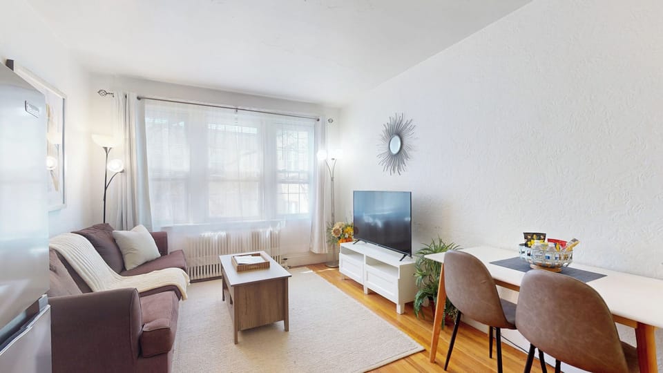 Bright living room with cozy seating and stylish decor. 
