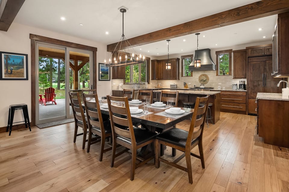 Larkspur Woods: - Dining table seats 8 with direct access to the outdoor living area.