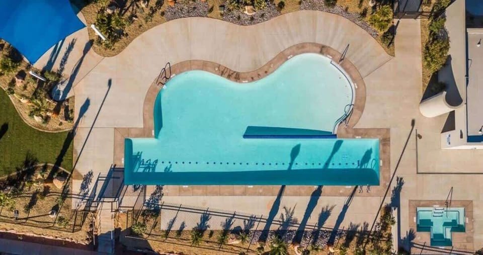 This home is one of the few homes that surrounds the pool complex.