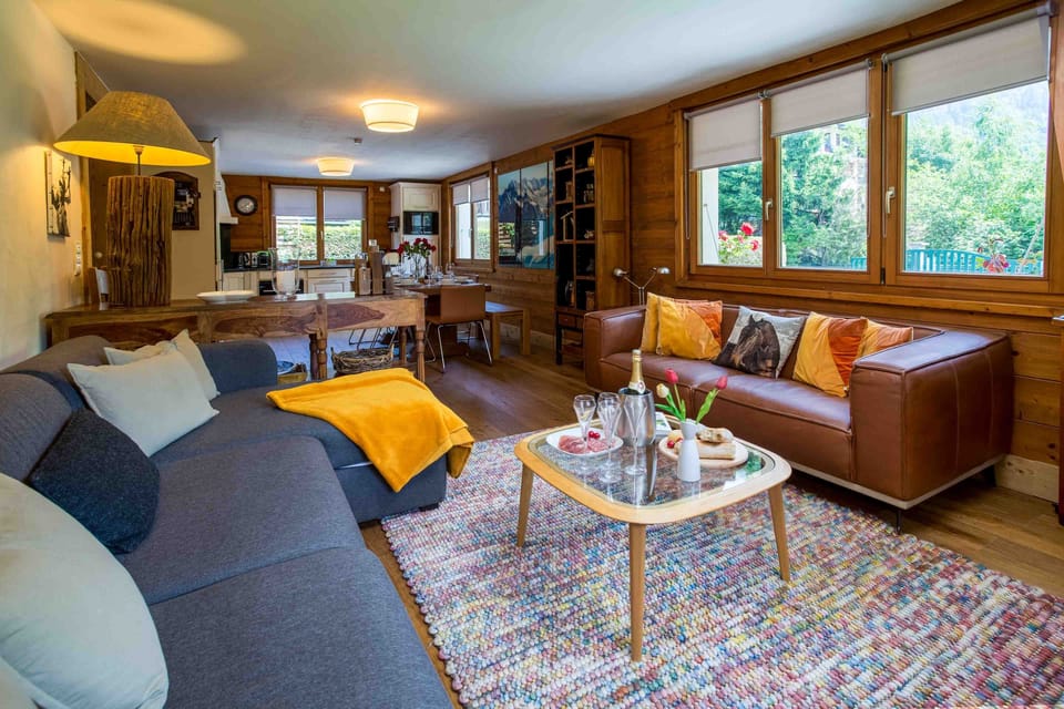 Open plan living area with lounge, dining and kitchen