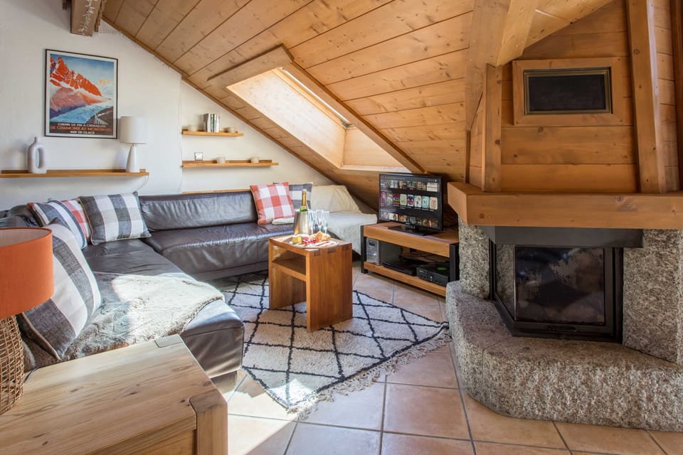 Lounge area with TV and fireplace
